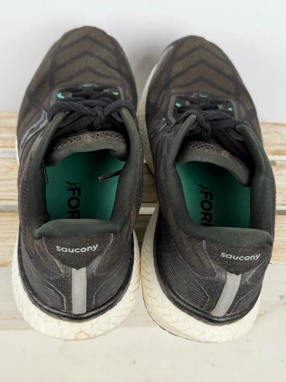 Saucony Triumph 19 running shoes in black an white with subtle teal accents 10.5